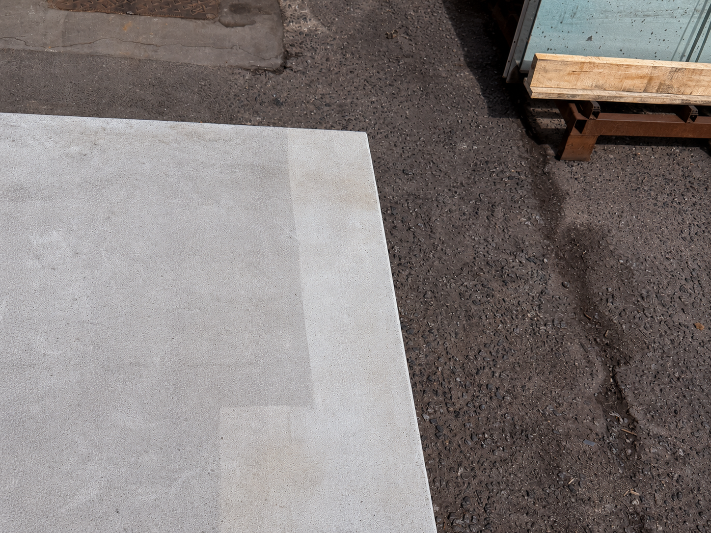 Visible cleaned and uncleaned areas on a GRC surface after a laser cleaning test